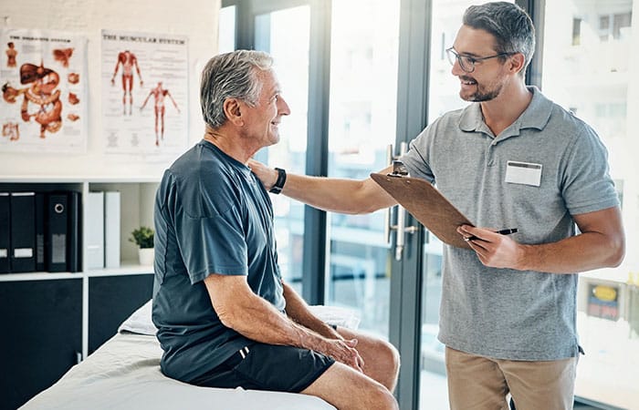 Older patient talking with doctor